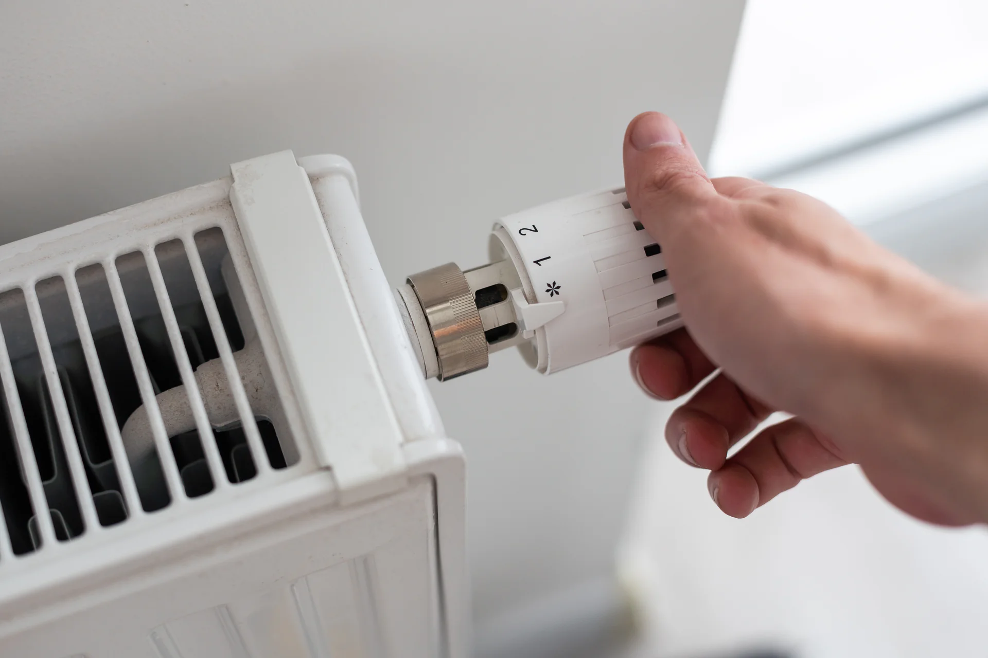 Std man s hand holding the regulation knob of domestic 2025 01 10 02 24 37 utc.jpg